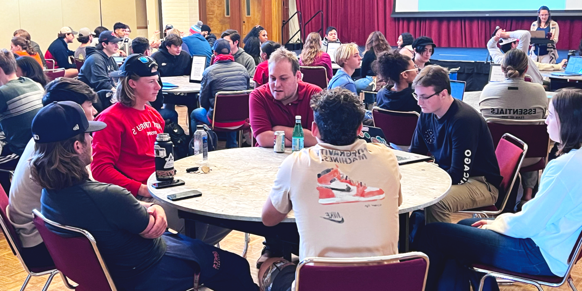 Students at a round table in Moraga Room during an Informal Curriculum workshop