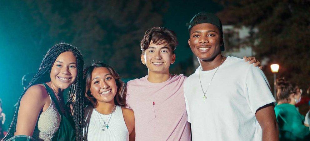 Students smiling at a carnival